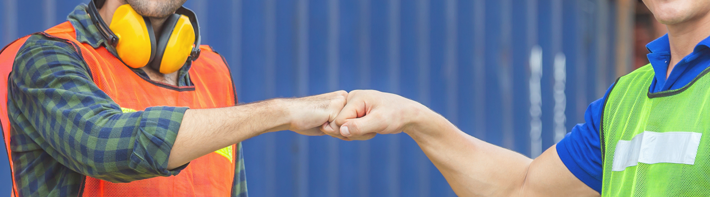 Two men fistbump