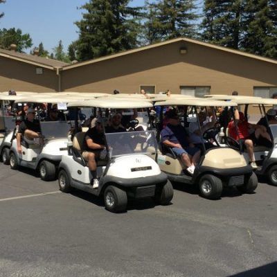 Golfers in carts at the Spring Golf Tournament At The Woodbridge Golf & Country Club